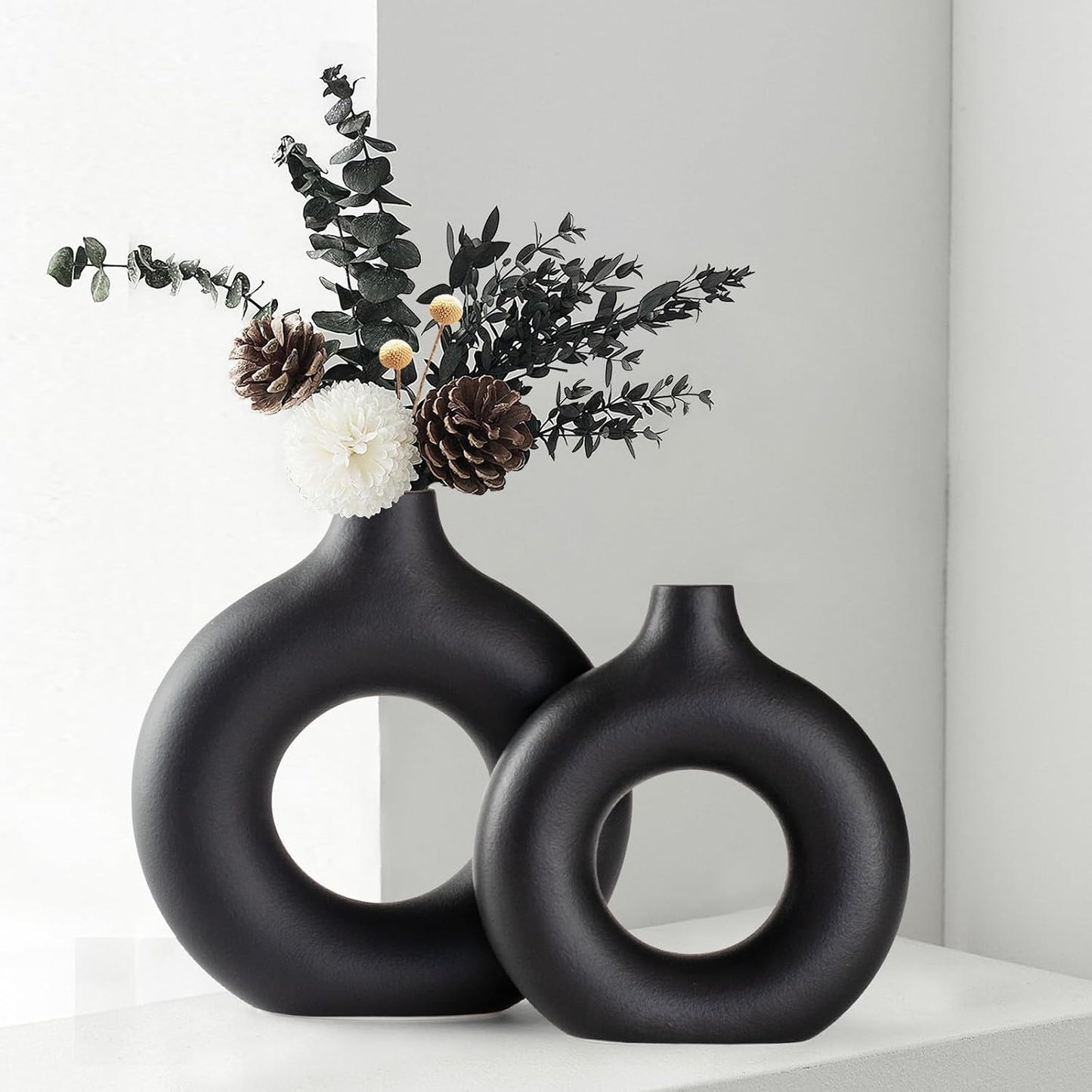 Black donut-shaped ceramic vase set
