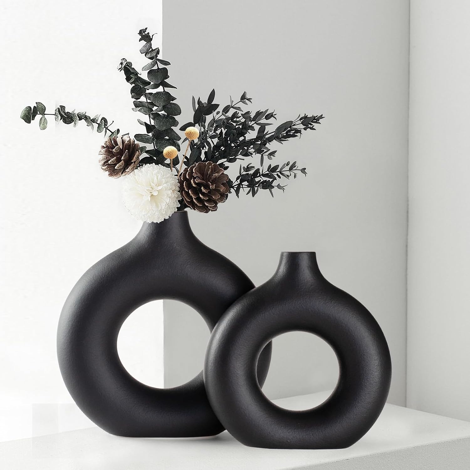 Black donut-shaped ceramic vase set