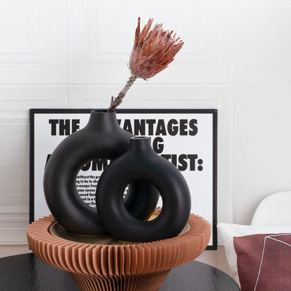 Black donut vase set styled on a table