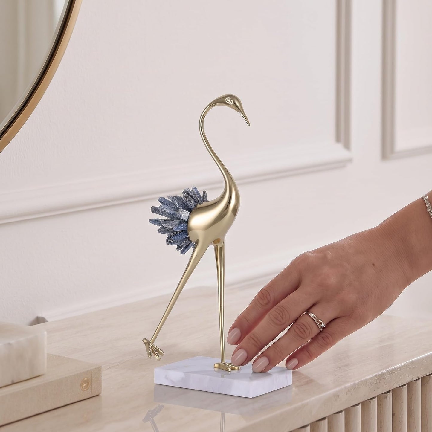 Brass bird sculpture, side view