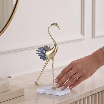 Brass bird sculpture, side view