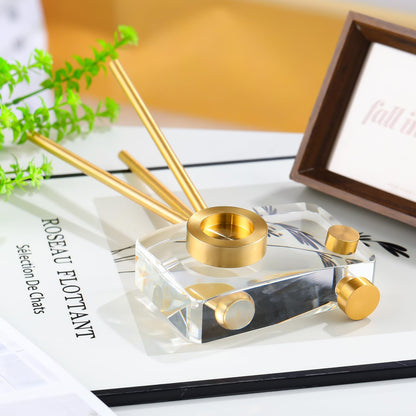 Golden crystal camera sculpture styled on coffee table