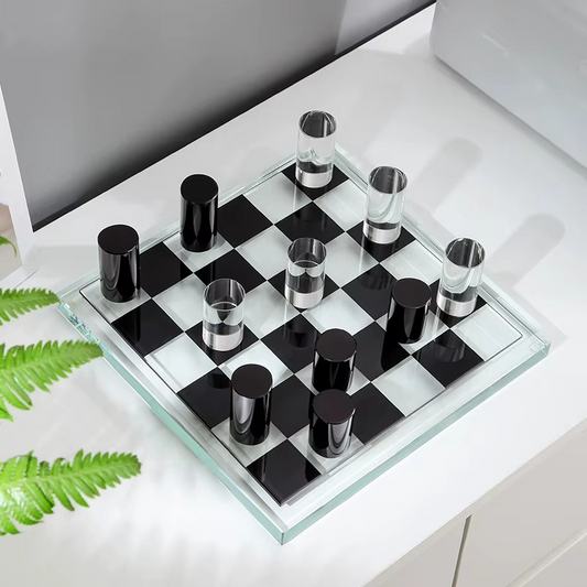 Crystal-style glass chess set with clear and black glass pieces on a checkered glass board