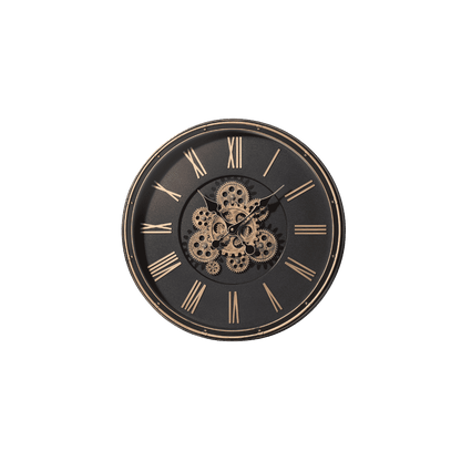 A round black wall clock with a skeleton center showing exposed gold-toned gears, Roman numeral hour markers, and matching hands on a plain white background.