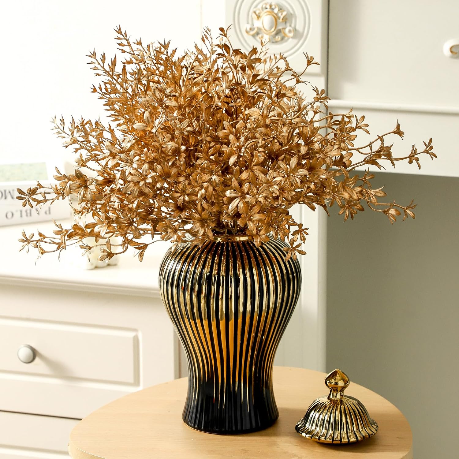 Black ginger jar set styled on a table