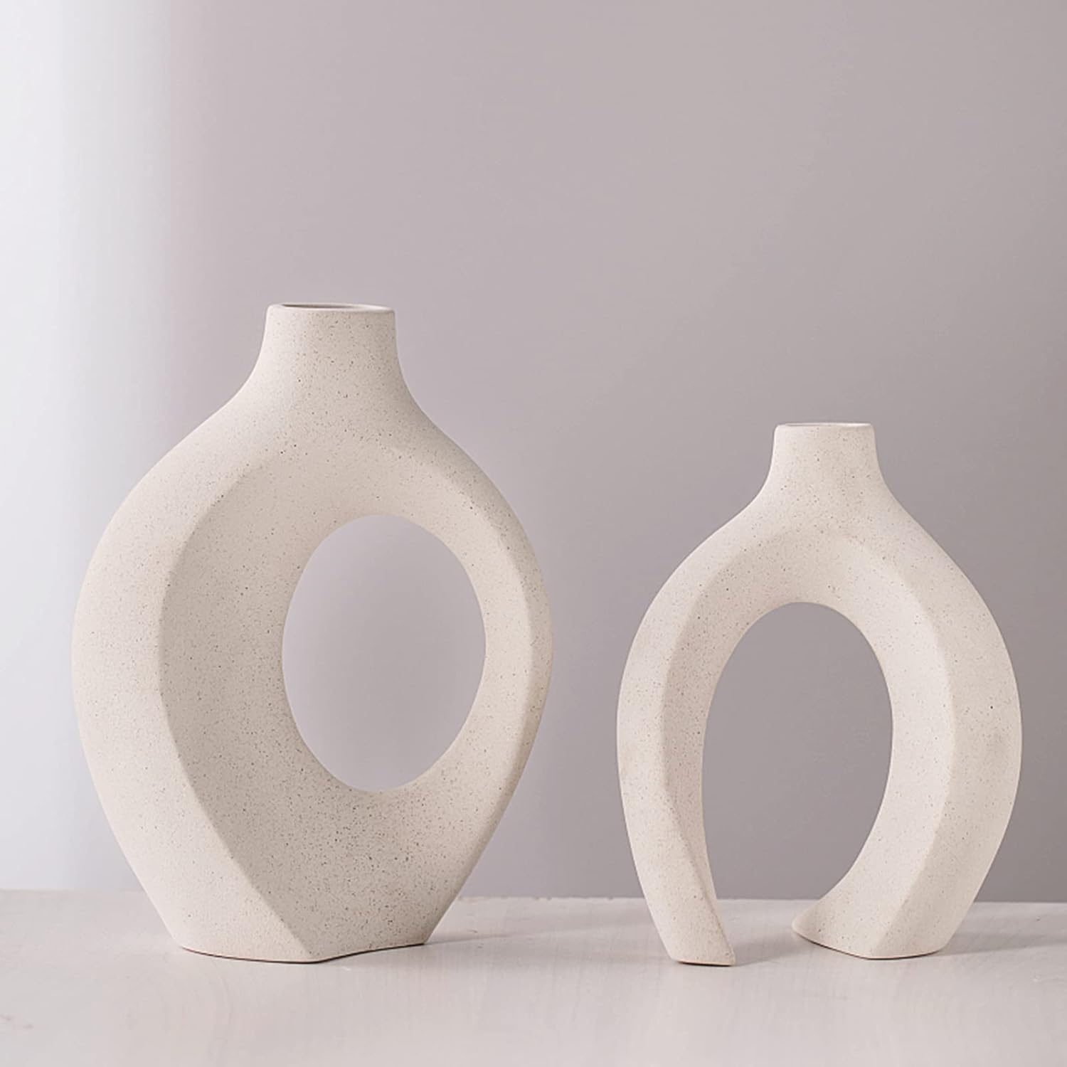 Hollow ceramic vases pair on entryway console