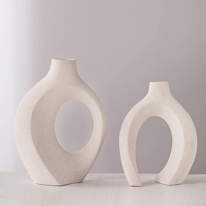 Hollow ceramic vases pair on entryway console