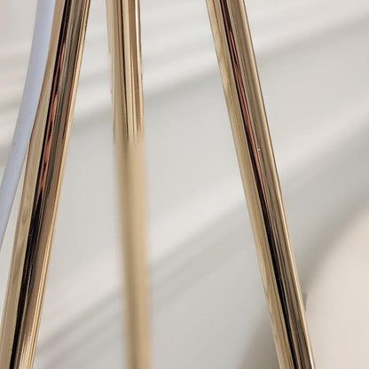 Tripod feather floor lamp illuminated