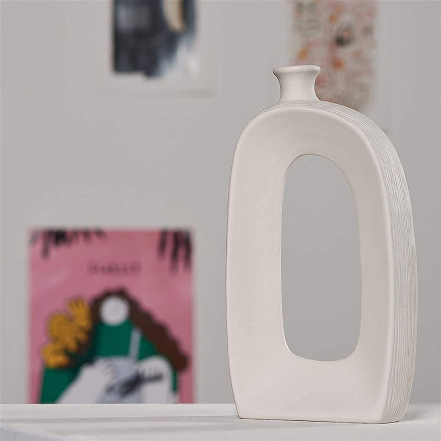 Porcelain flower vase styled with floral stems