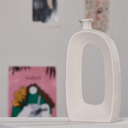 Porcelain flower vase styled with floral stems