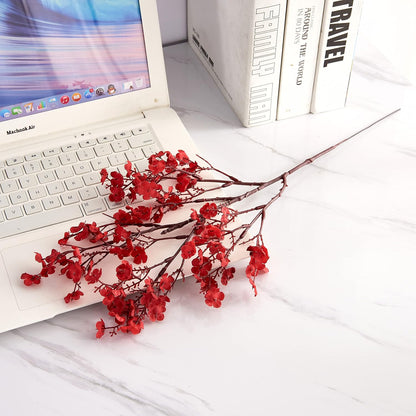 Red baby breath stem styled in a vase