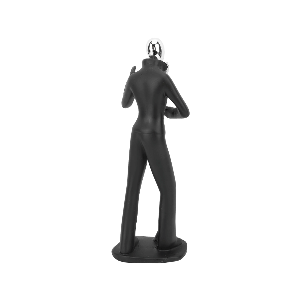 Singer figurine styled on a shelf