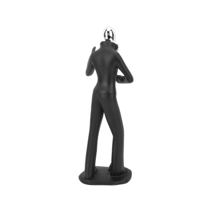 Singer figurine styled on a shelf