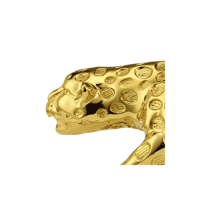 Golden leopard sculpture, close-up detail view