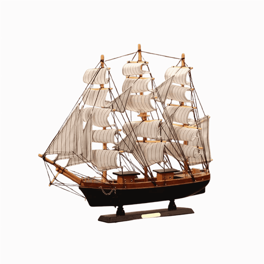 Wooden sailboat model for coastal-themed interiors