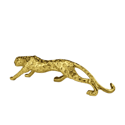 Golden leopard sculpture styled on coffee table