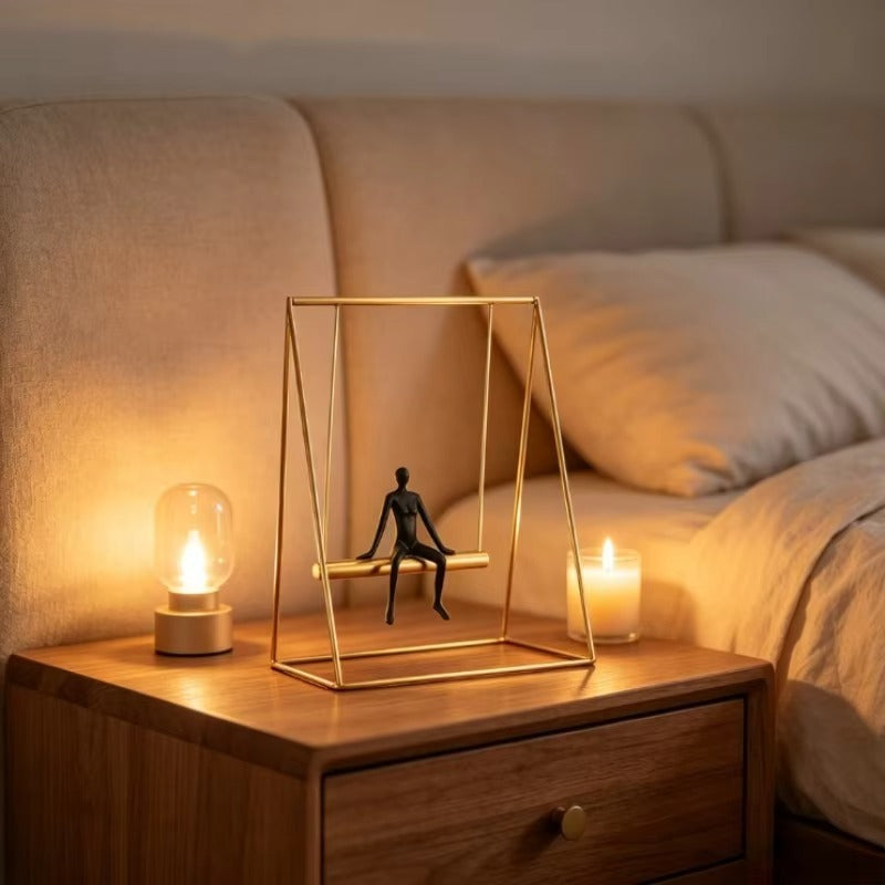 Metal swing figurine sculpture, close-up detail